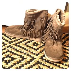 Brown Sherpa-lined Uggs with fringe
